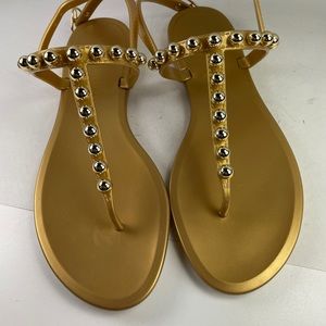 New in box Stuart Weitzman gold metallic Goldie jelly sandals 9B